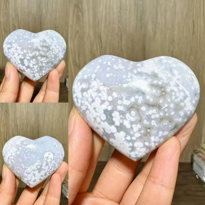 Ocean Jasper Crystal Heart from Crystal Destiny, featuring white orbs on a light blue-grey polished stone.