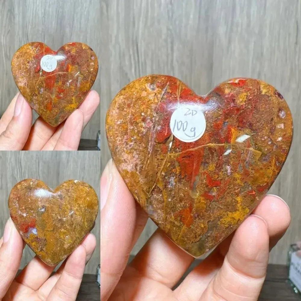 Polished Ocean Jasper Crystal Heart from Crystal Destiny, featuring warm reds, oranges, and browns with unique patterns.
