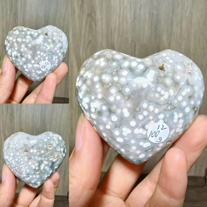 Ocean Jasper crystal heart from Crystal Destiny, featuring white orbs on a gray and brown polished stone.