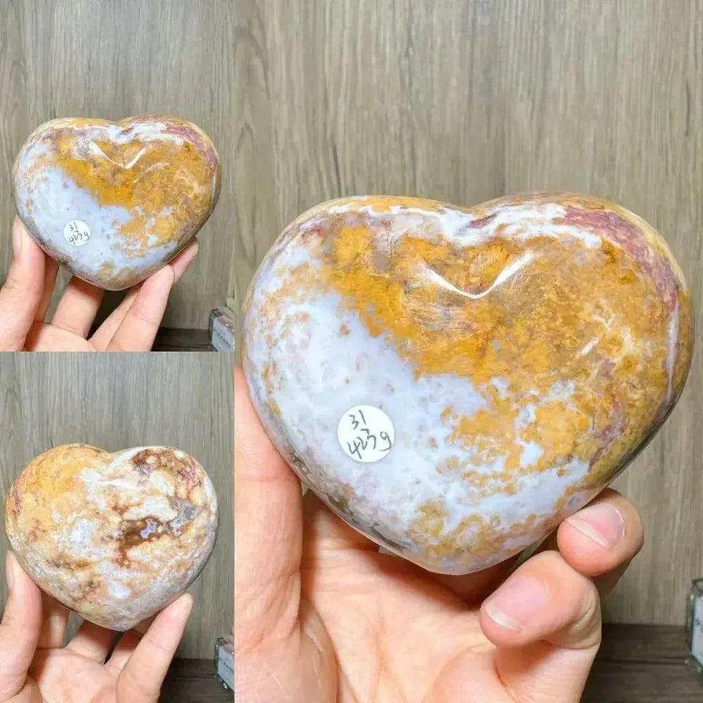 Polished Ocean Jasper Crystal Heart from Crystal Destiny, featuring swirling gold, white, and pink patterns.