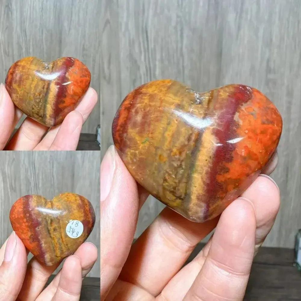 Polished Ocean Jasper crystal heart from Crystal Destiny, featuring vibrant red, orange, and brown swirls.