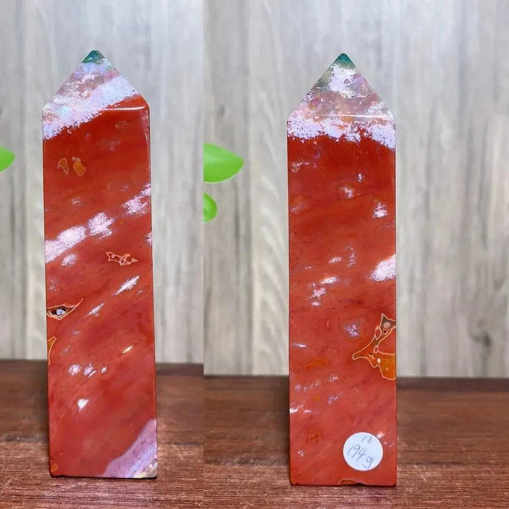 Vibrant red Ocean Jasper crystal tower with white and green swirls, promoting joy and emotional healing from Crystal Destiny.