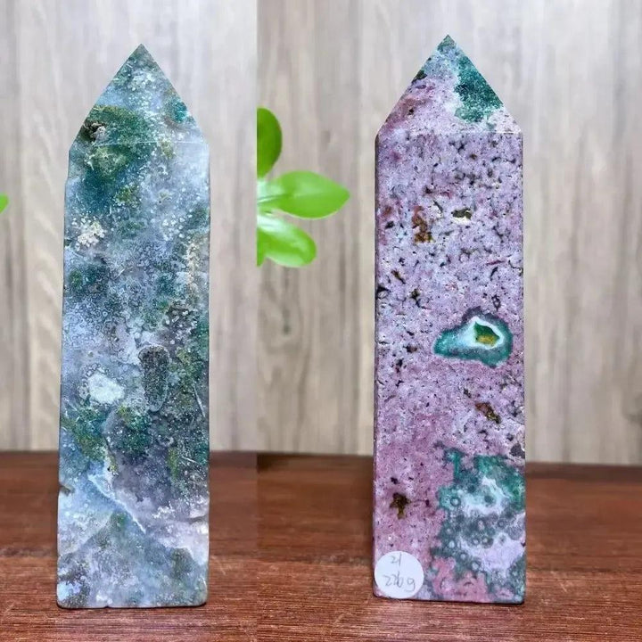 Two pointed Ocean Jasper crystal towers from Crystal Destiny, one green/blue, one pink/purple, for healing.