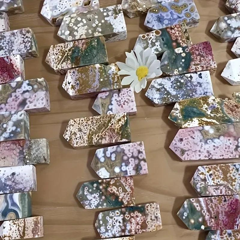 Assorted Ocean Jasper crystal towers with unique orbicular patterns in various colors, ideal for healing and creativity.