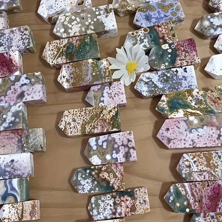 Assorted Ocean Jasper crystal towers with unique orbicular patterns in various colors, ideal for healing and creativity.