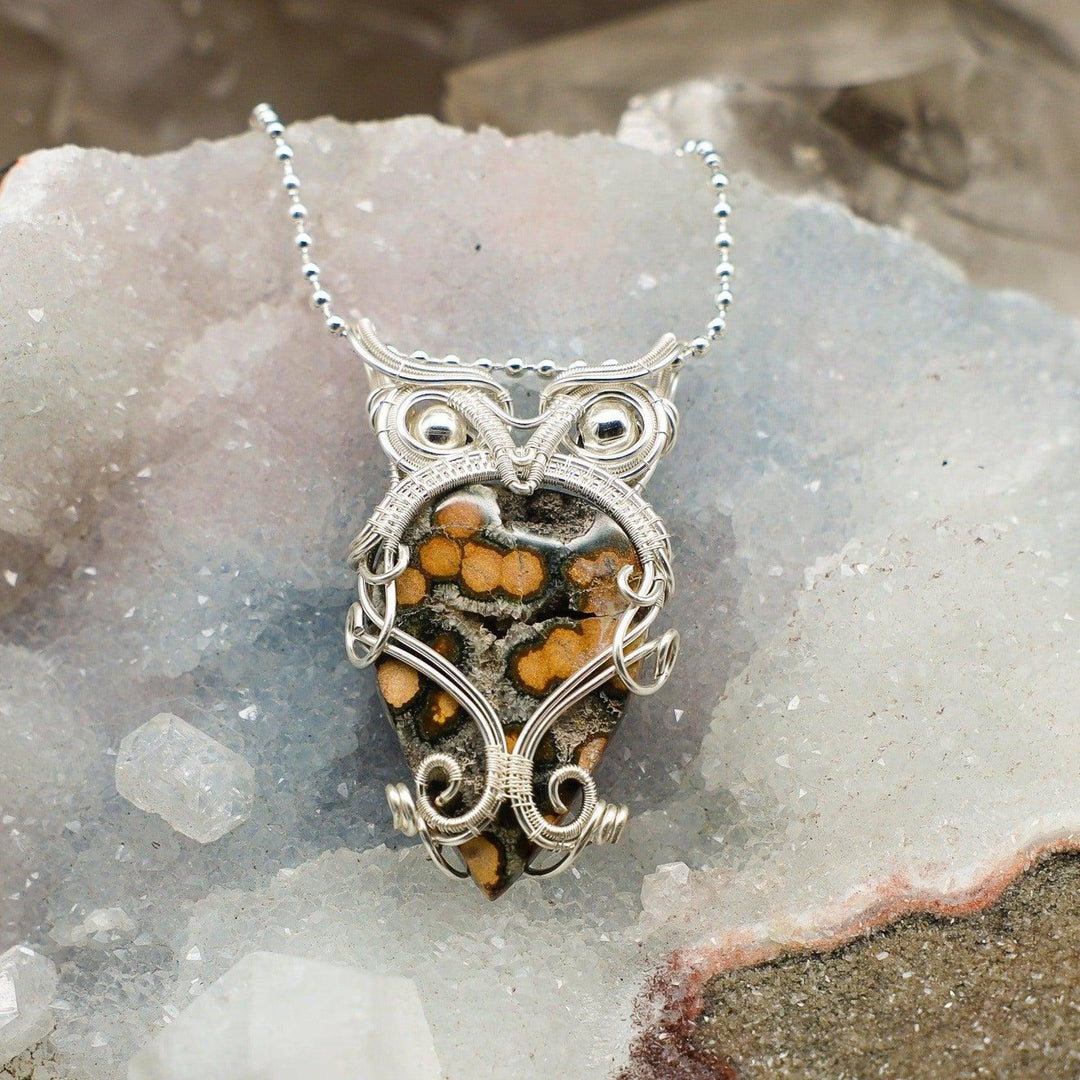 Ocean Jasper Owl Wire Wrap Pendant: Handcrafted silver wire owl pendant with unique green, cream, and orange Ocean Jasper.