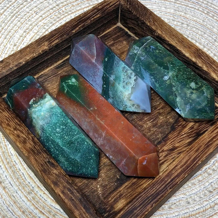 Polished Ocean Jasper double point towers featuring green, cream, and pink orb patterns for heart and throat chakra healing.