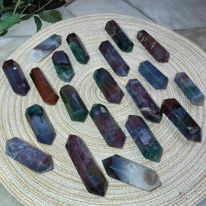 Polished Ocean Jasper double point towers in green, cream, and pink, featuring unique orb patterns for heart chakra healing.