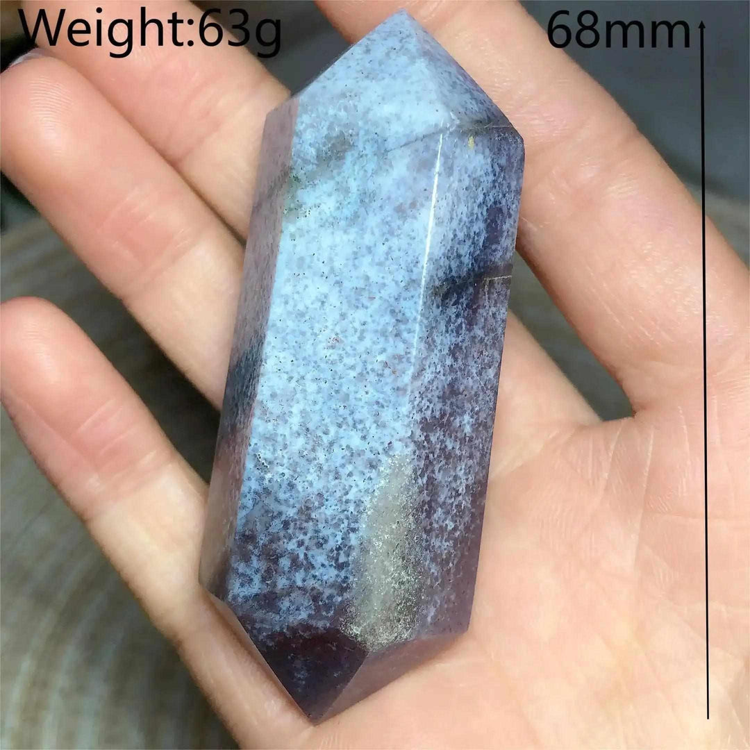 Polished Ocean Jasper double point tower with blue and purple orb patterns, held in hand for Heart Chakra healing.