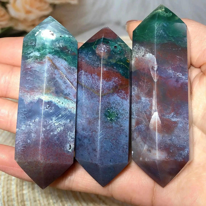 Three polished Ocean Jasper double point towers featuring vibrant green, cream, and pink orb patterns for heart chakra healing.
