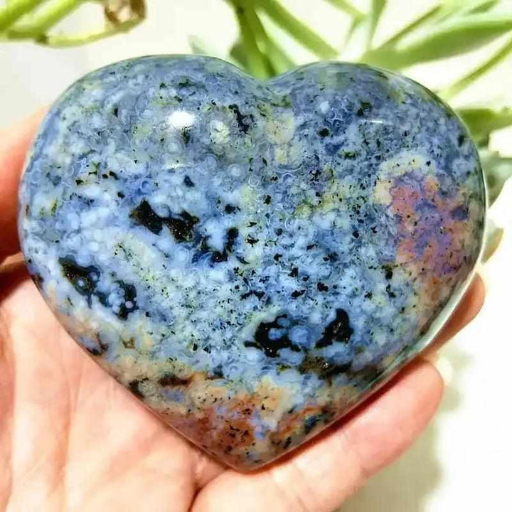 Polished Ocean Jasper heart featuring calming sea green and cream orb patterns, perfect for Heart Chakra meditation.