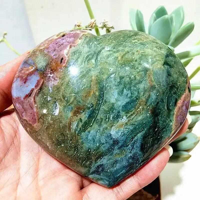 Polished Ocean Jasper heart with sea green, cream, and blush orb patterns, perfect for calming Heart Chakra meditation.