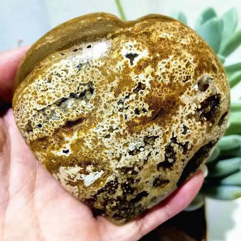 Polished Ocean Jasper heart featuring intricate orb patterns in earthy tones, perfect for Heart Chakra meditation.