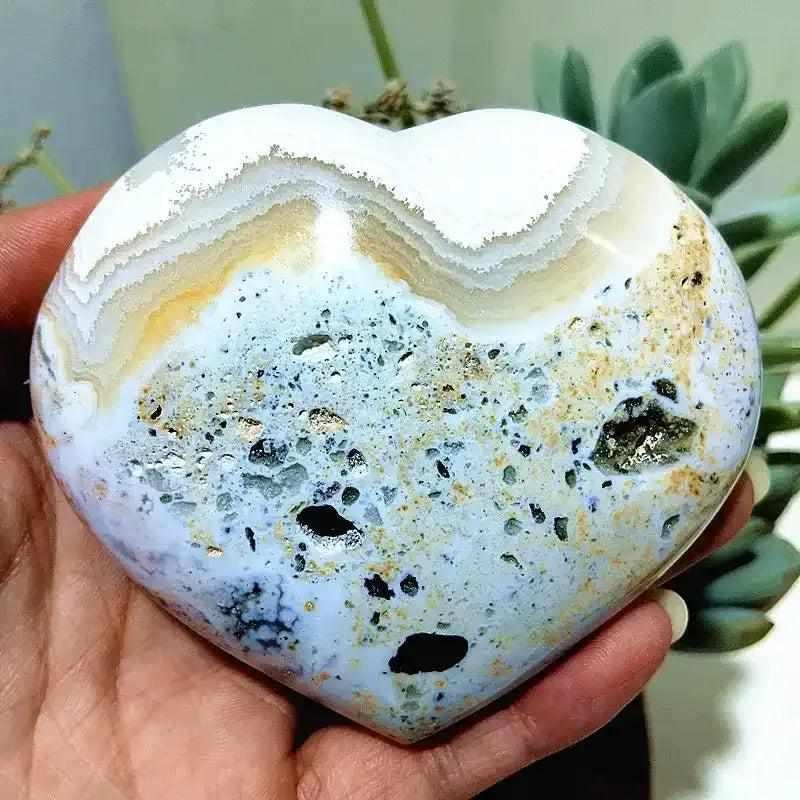 Polished Ocean Jasper heart featuring sea green, cream, and blush orb patterns for calming Heart Chakra energy.