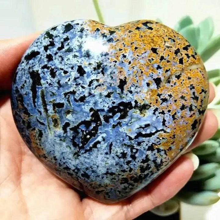 Polished Ocean Jasper heart featuring blue, black, and gold orb patterns for Heart Chakra calm and gentle reflection.