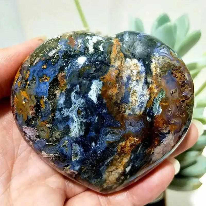 Polished Ocean Jasper heart featuring deep blue, cream, and earthy tones for calming Heart Chakra energy.
