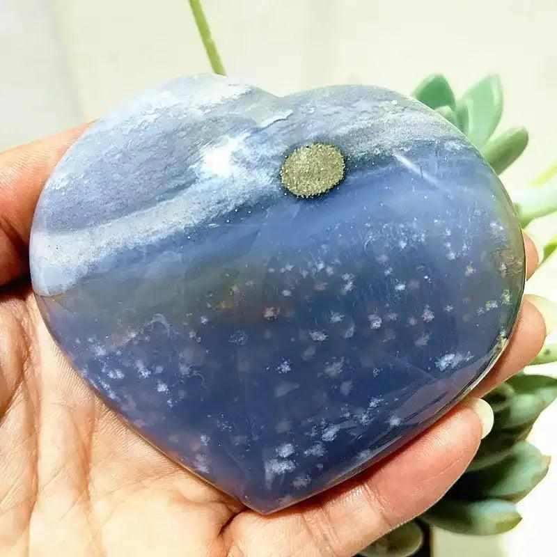 Polished Ocean Jasper heart in sea green and cream with orb patterns, perfect for Heart Chakra calm and reflection.