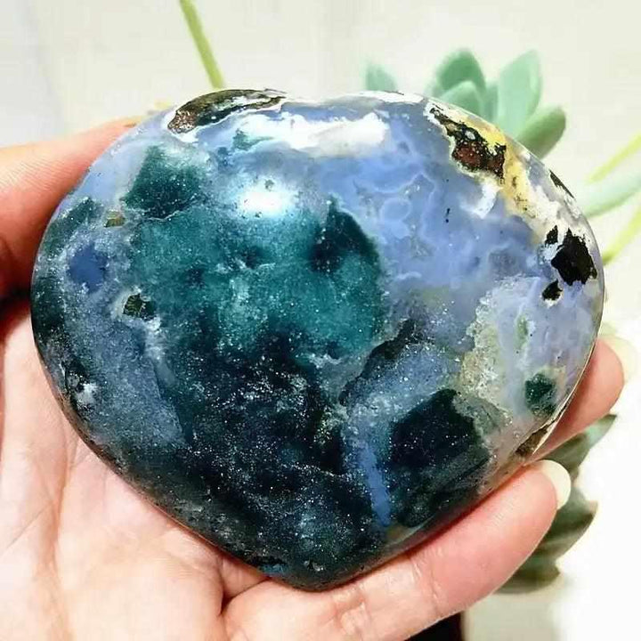 Polished Ocean Jasper heart with deep sea green and blue orb patterns, perfect for Heart Chakra calm and self-expression.