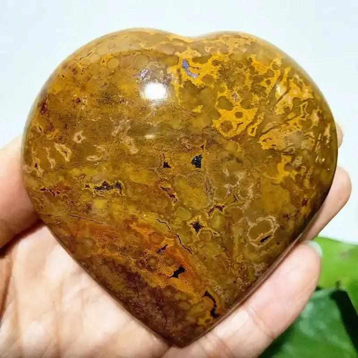 Polished Ocean Jasper heart stone featuring earthy brown and gold orbicular patterns for Heart Chakra healing and tranquility.