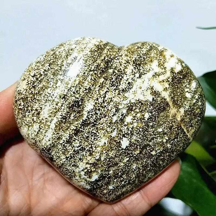 Polished Ocean Jasper heart stone featuring green and white orb patterns, perfect for Heart Chakra healing and tranquility.