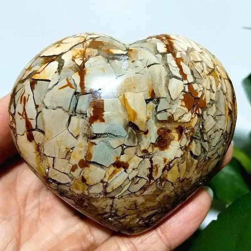 Polished Ocean Jasper heart stone featuring creamy, swirling patterns and earthy tones for heart chakra healing.