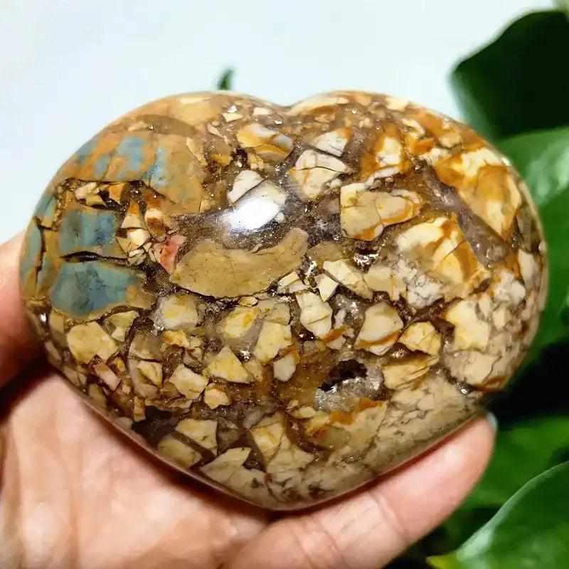 Polished Ocean Jasper heart stone featuring swirling green, white, and tan orb patterns for Heart Chakra healing.