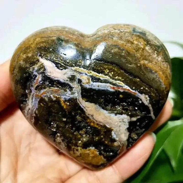 Polished Ocean Jasper heart stone featuring swirling green, brown, and white orb patterns for Heart Chakra healing.
