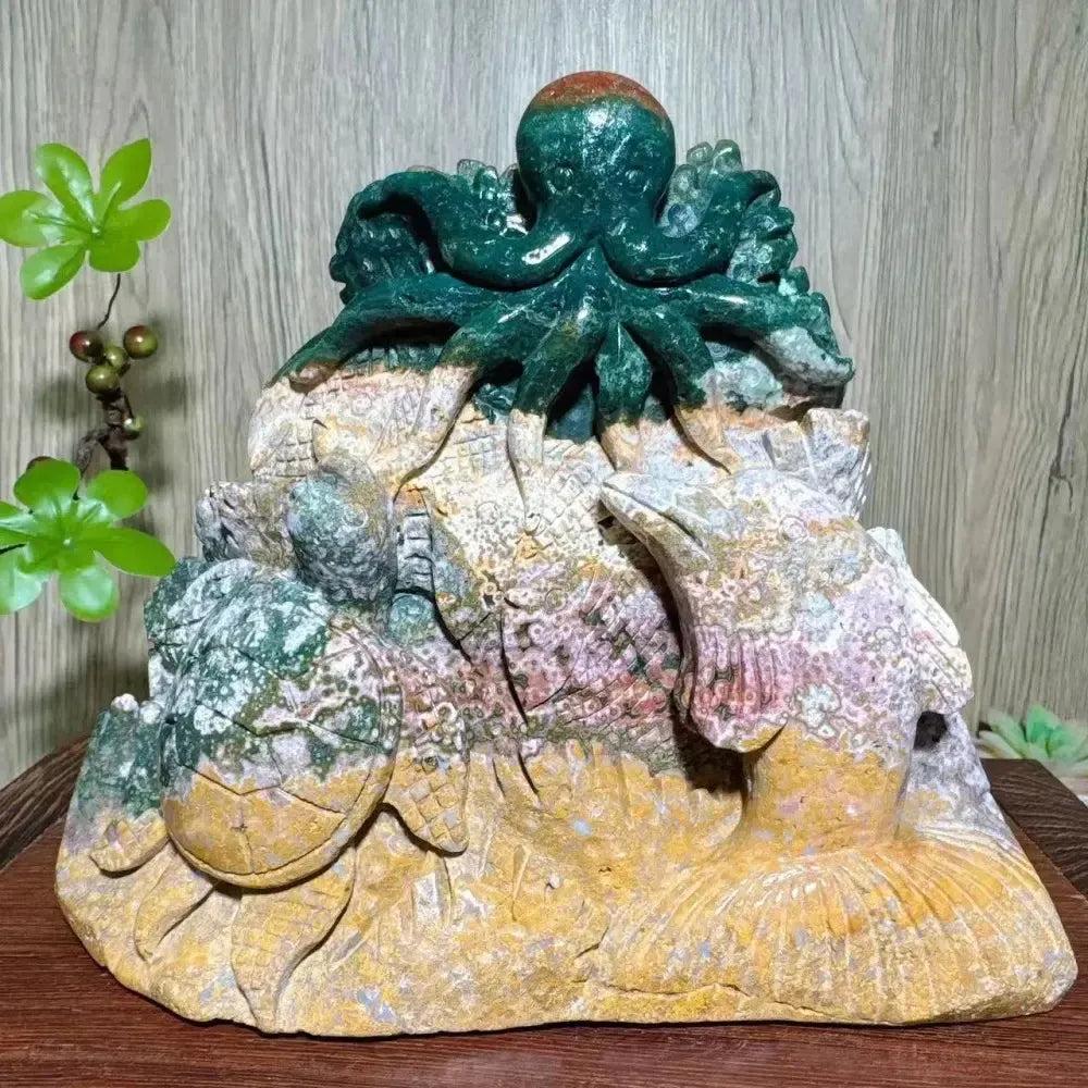 Hand-carved Ocean Jasper "Ocean World" sculpture by Crystal Destiny, featuring a green octopus, turtle, dolphin, and fish.
