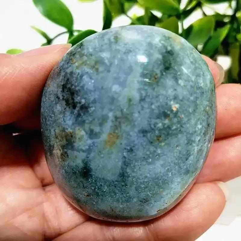Smooth Ocean Jasper palm stone with calming green and cream swirls, perfect for Heart Chakra meditation and stress relief.