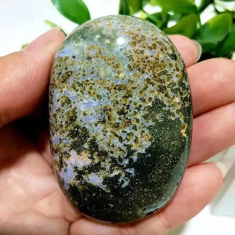 Smooth Ocean Jasper palm stone with green, cream, and pink orbs, perfect for Heart Chakra healing and calming meditation.