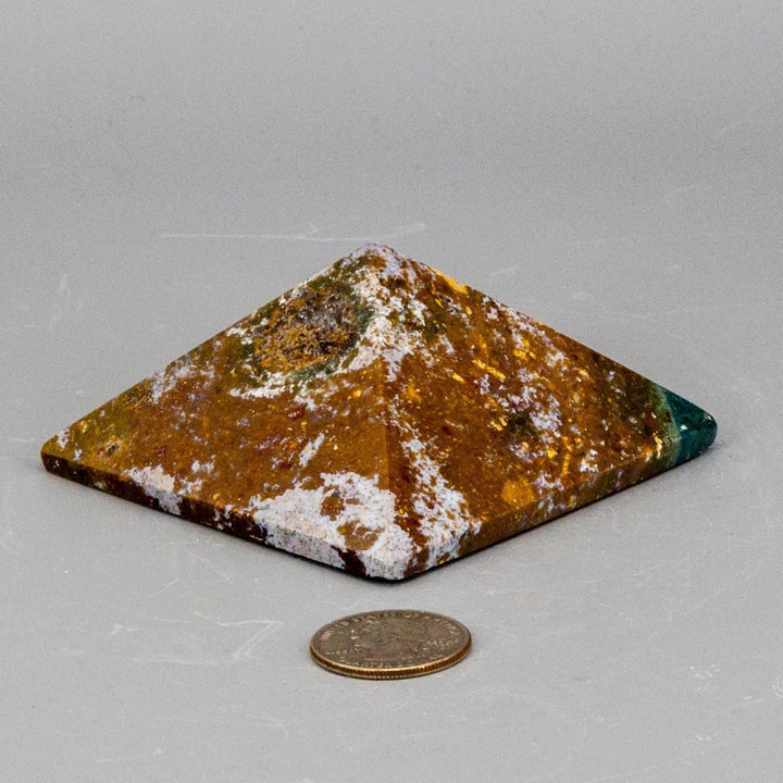 Crystal Destiny's Ocean Jasper pyramid, 3" with earthy tones, orb, and swirl patterns, next to a coin.