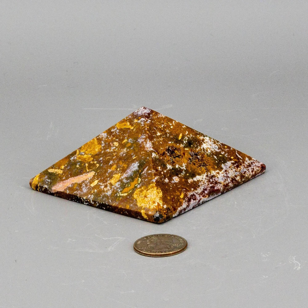 Crystal Destiny Ocean Jasper pyramid, 3.25" with earthy tones, swirling patterns, and orbs, next to a coin.