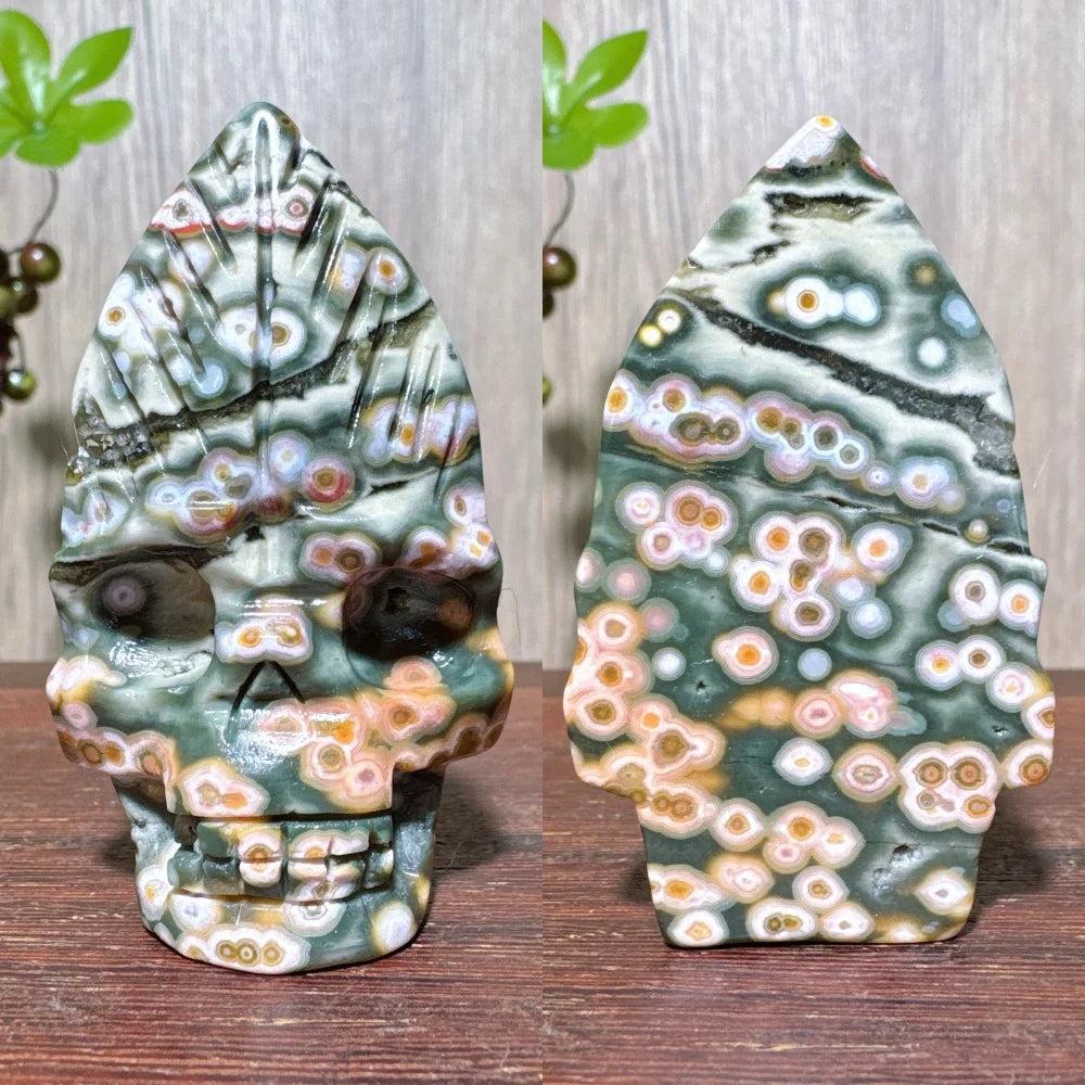 Extraordinary Ocean Jasper Skull Carving with Raw Druzy. Unique green, orange, and white orb patterns.