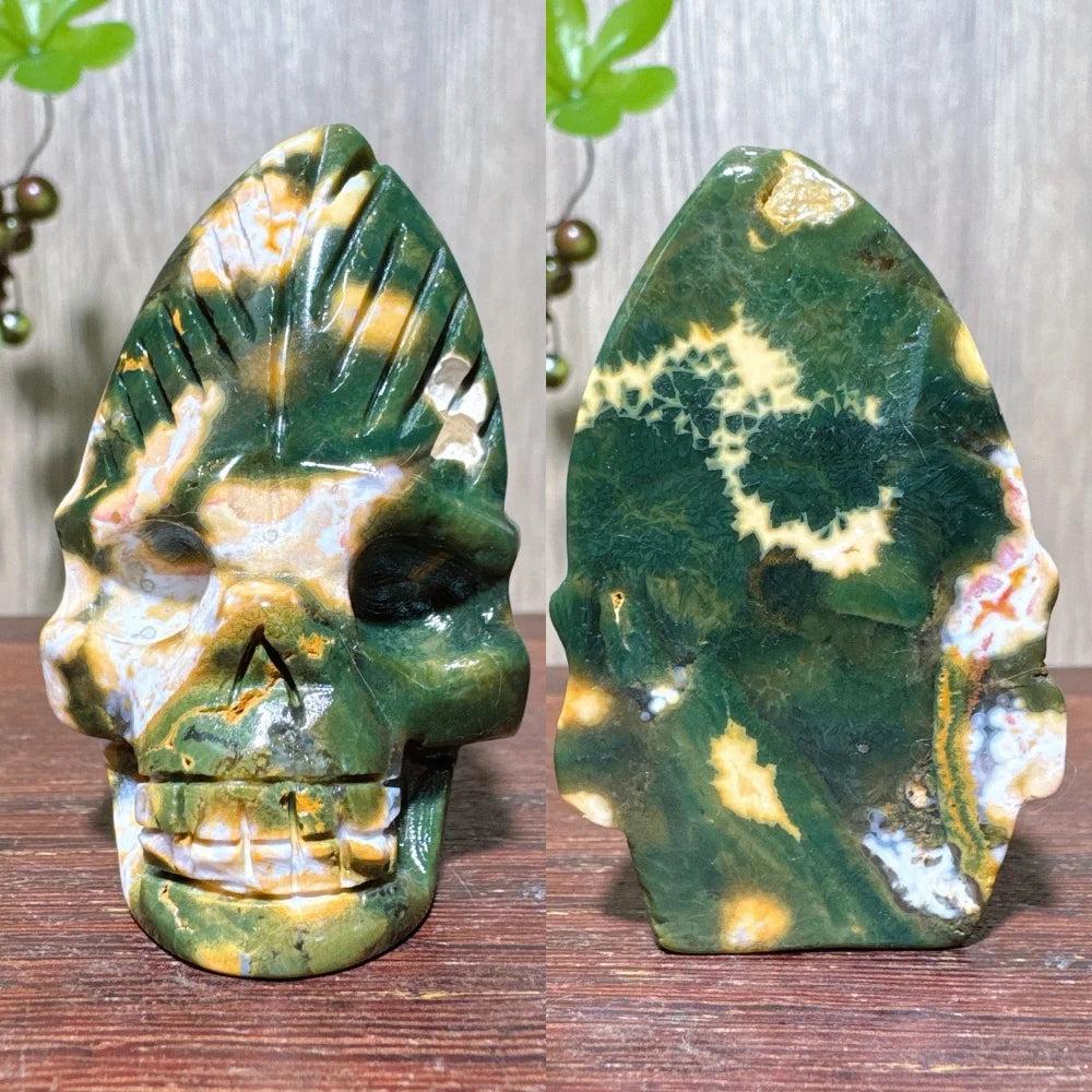 Extraordinary Ocean Jasper Skull Carving with Raw Druzy. Green, yellow, and white swirling patterns.