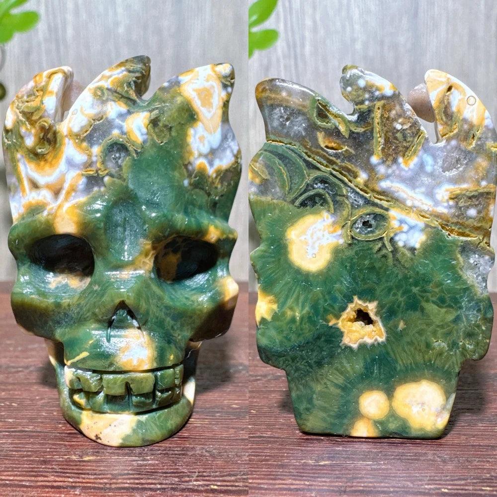 Extraordinary Ocean Jasper Skull Carving with raw druzy, swirling green, yellow, and white patterns.