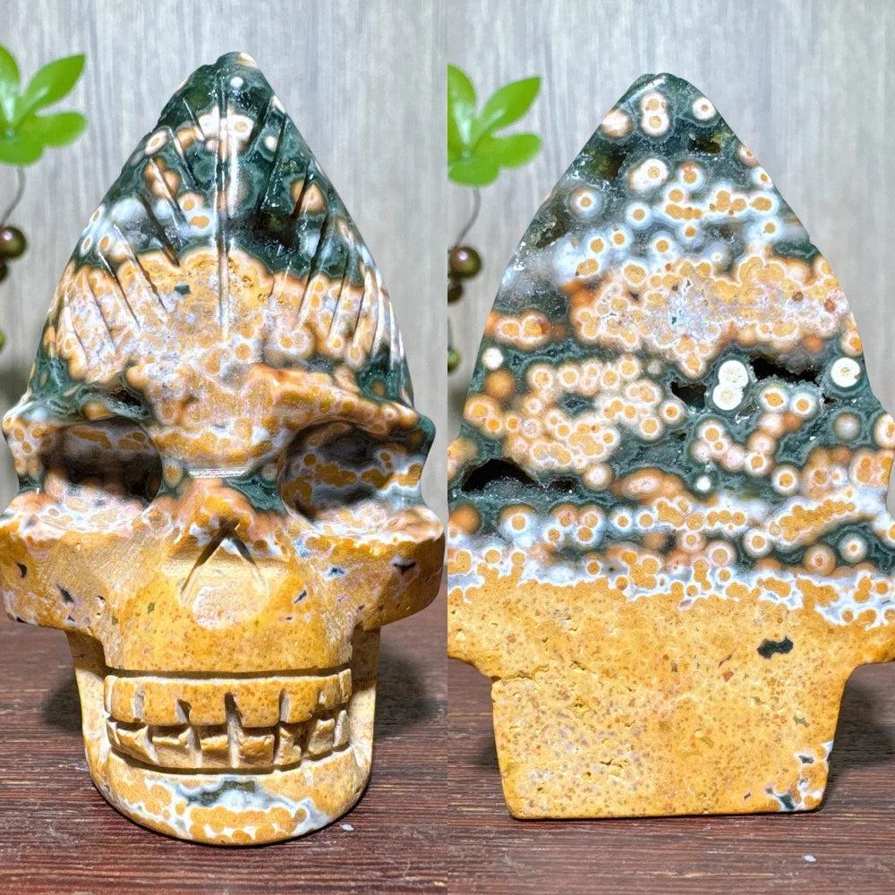 Extraordinary Ocean Jasper Skull Carving with raw druzy, a swirling map of green, orange, and white orbs.