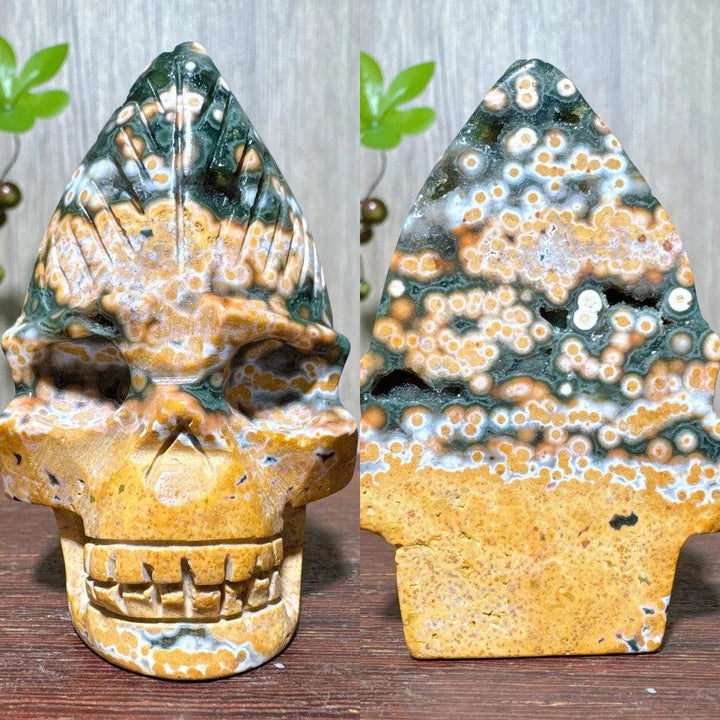 Extraordinary Ocean Jasper Skull Carving with raw druzy, a swirling map of green, orange, and white orbs.