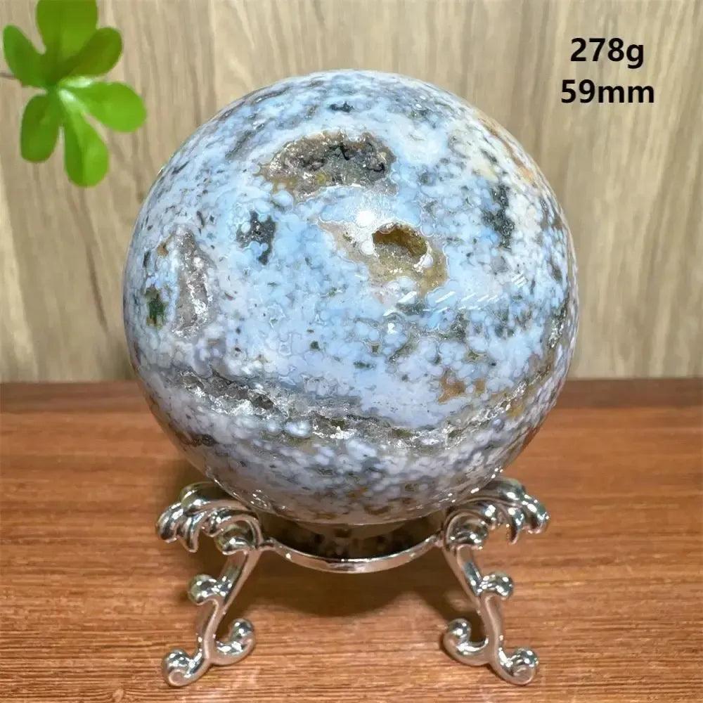 Ocean Jasper sphere from Crystal Destiny, 278g, 59mm, with blue, white, and brown orbicular patterns on a silver stand.