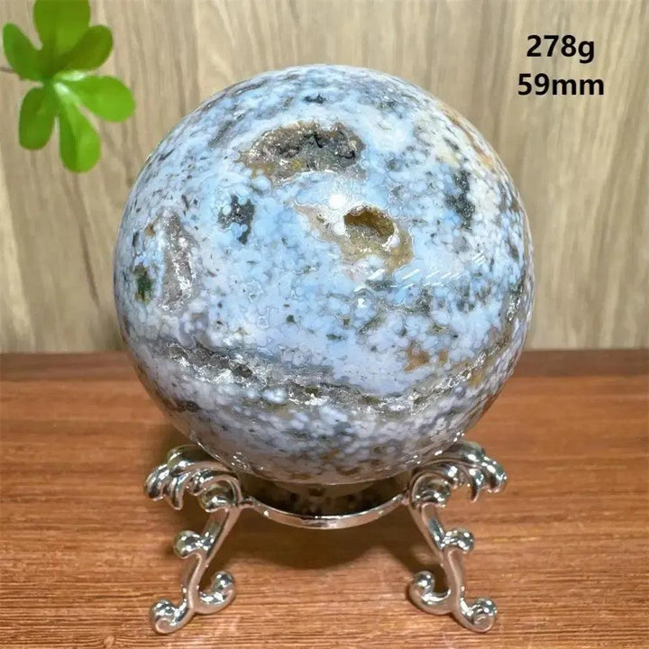 Ocean Jasper sphere from Crystal Destiny, 278g, 59mm, with blue, white, and brown orbicular patterns on a silver stand.