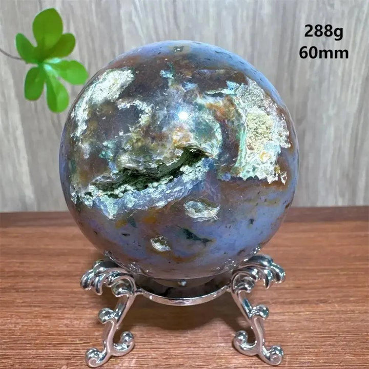 Ocean Jasper sphere from Crystal Destiny, 60mm, 288g, with unique green, brown, and purple orbicular patterns on a silver stand.