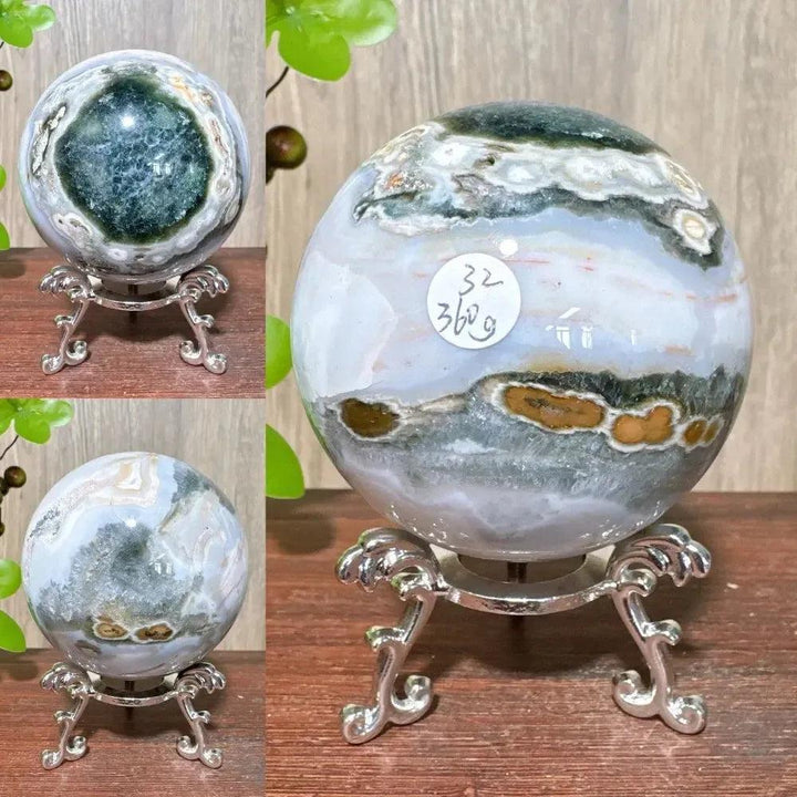 Crystal Destiny Ocean Jasper sphere with swirling greens, whites, and browns on a silver stand.