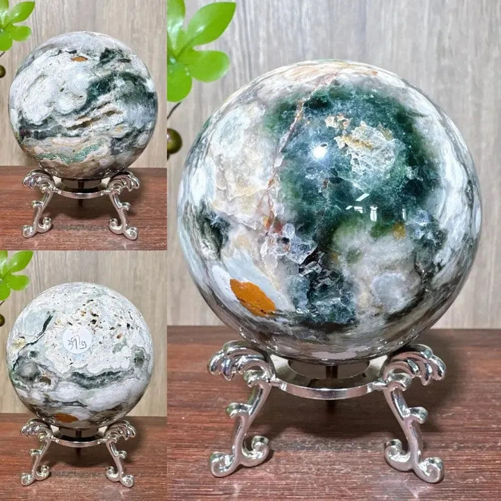 Ocean Jasper sphere from Crystal Destiny, featuring swirling greens, whites, and browns on a silver stand.