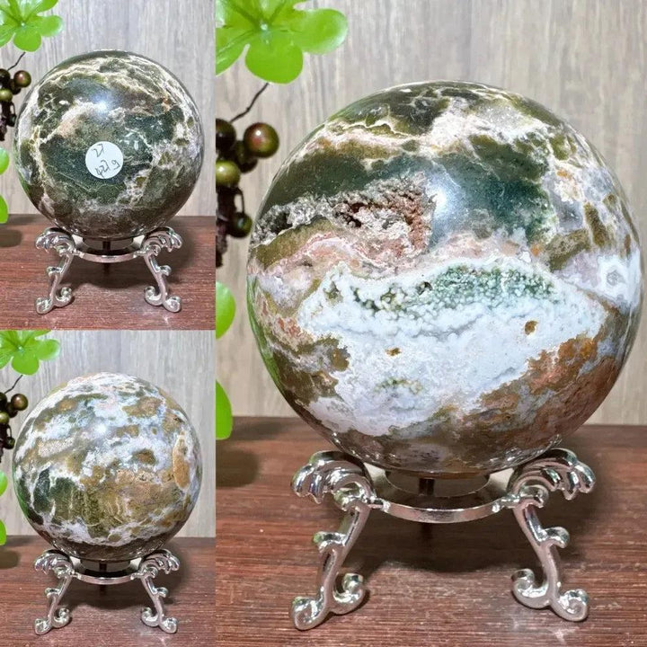 Crystal Destiny's Ocean Jasper sphere, a unique orbicular crystal with green, white, pink, and brown patterns on a silver stand.