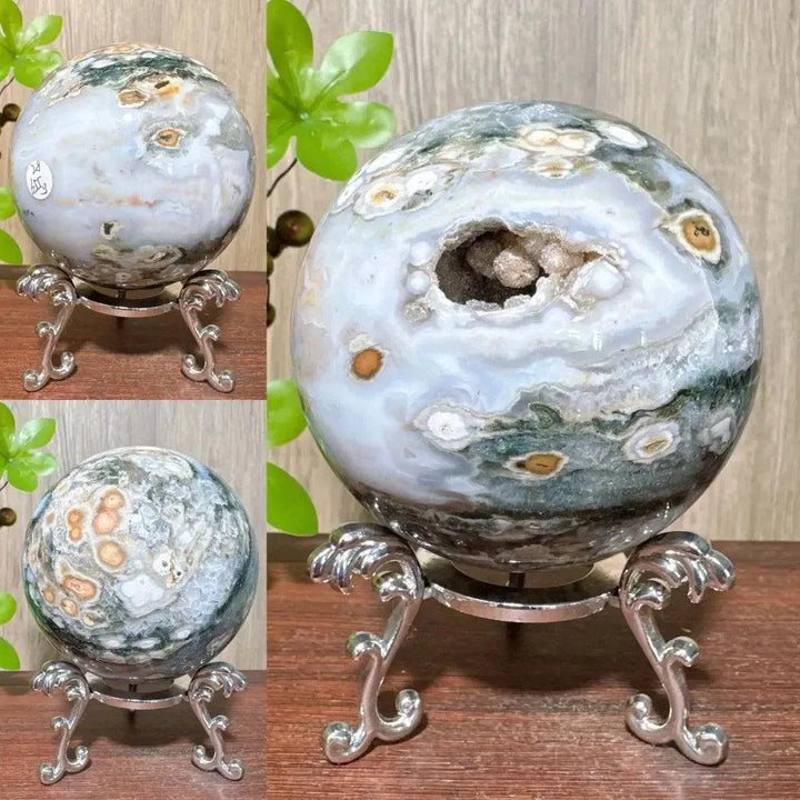 Ocean Jasper sphere from Crystal Destiny, featuring unique green, white, and brown orbicular patterns with a geode opening.