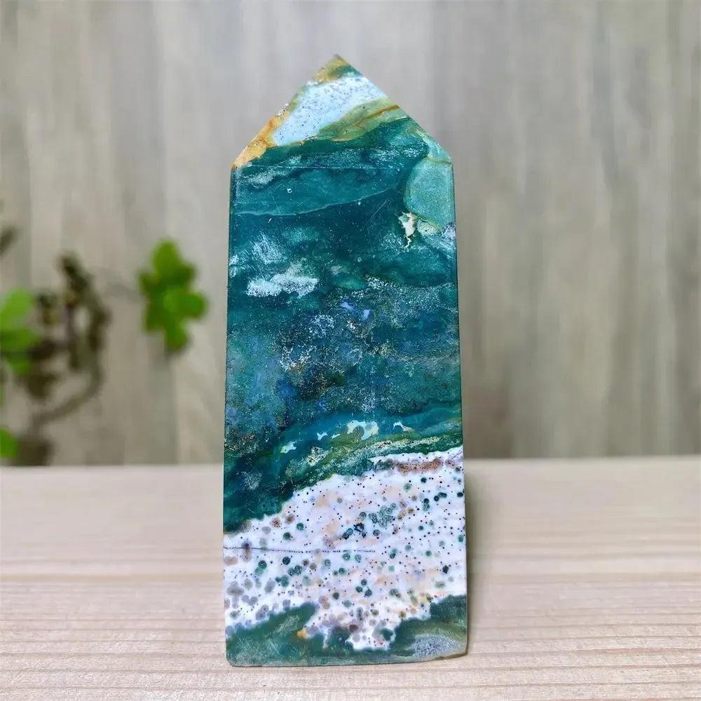 Polished Ocean Jasper tower with swirling blue, green, and white patterns, featuring sparkling Moss Agate druzy.