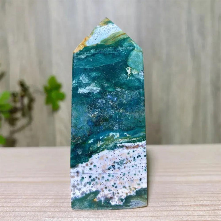 Polished Ocean Jasper tower with swirling blue, green, and white patterns, featuring sparkling Moss Agate druzy.