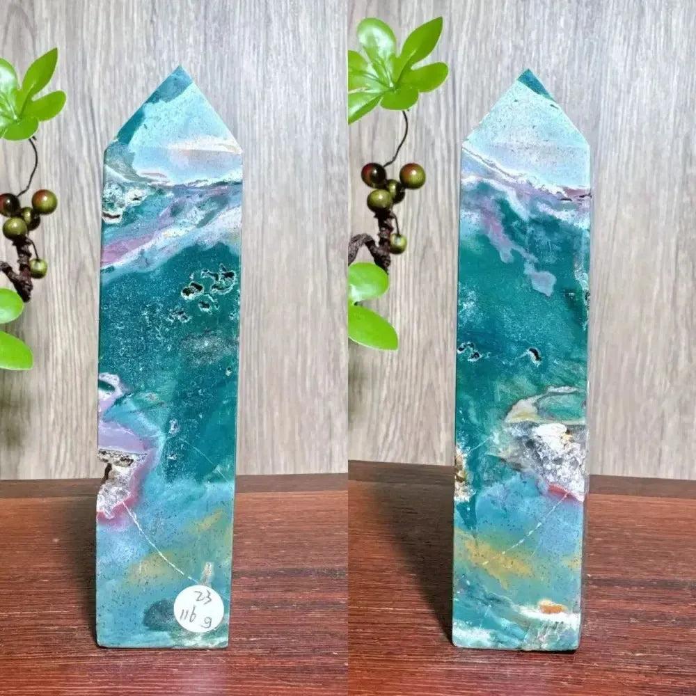 Polished blue Ocean Jasper tower with swirling orb patterns, sea-glass blues, and sparkling Moss Agate druzy inclusions.