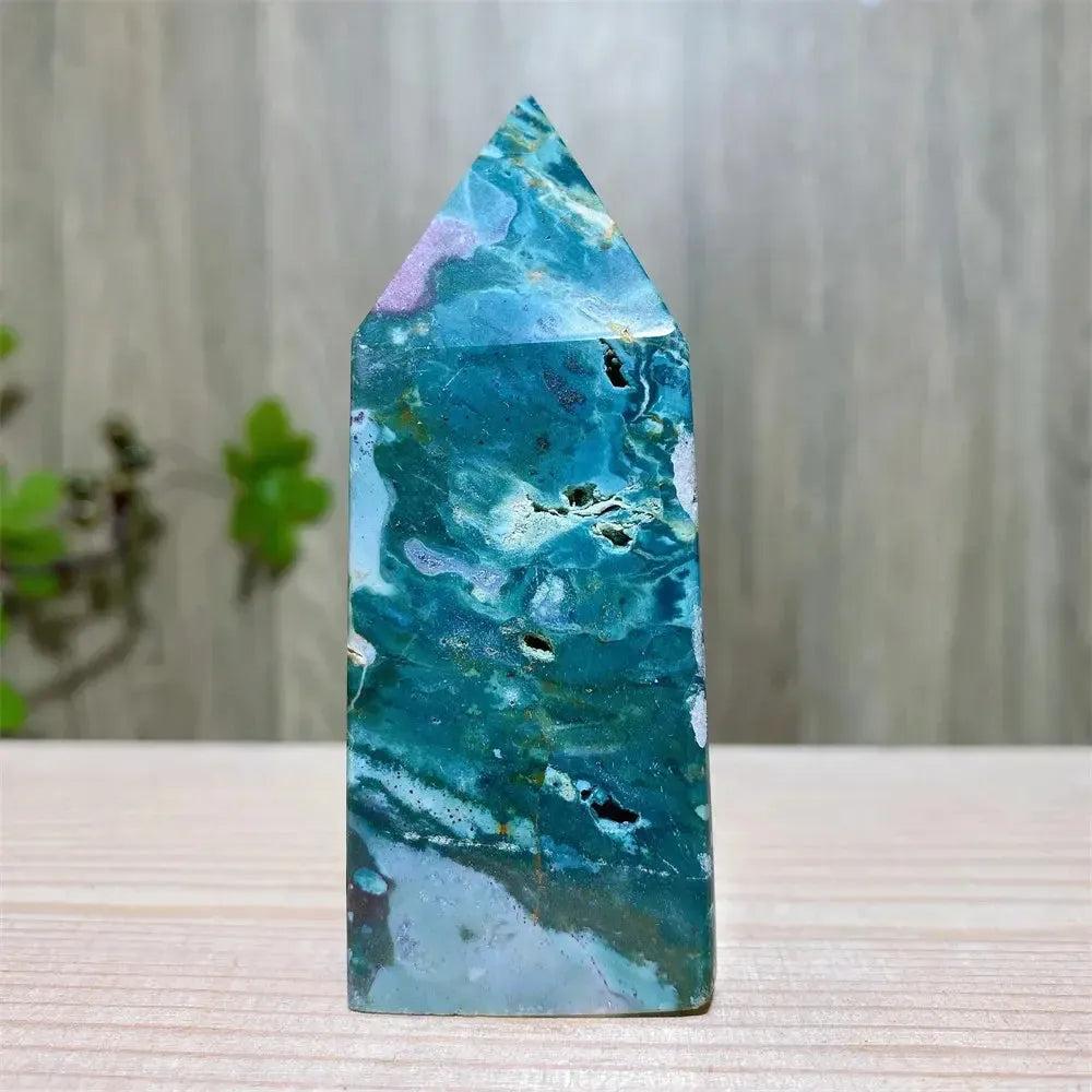 Polished blue, green, and cream Ocean Jasper tower with swirling orb patterns and sparkling druzy inclusions.