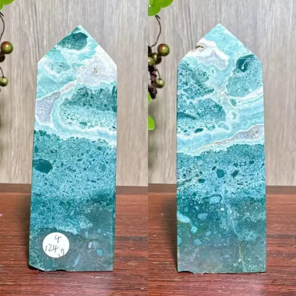 Polished blue Ocean Jasper tower with swirling orb patterns, sea-glass blues, and sparkling druzy inclusions.