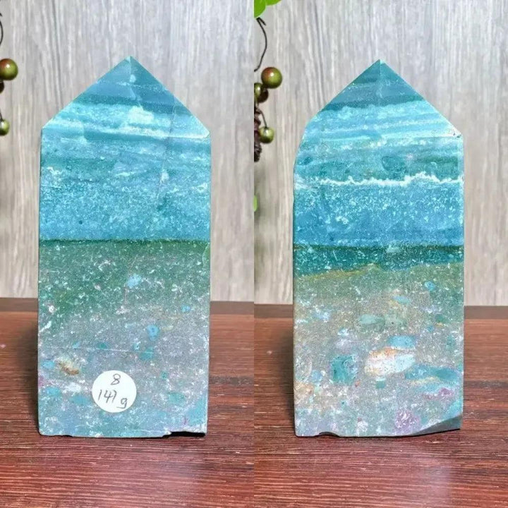 Polished blue Ocean Jasper tower with swirling orb patterns and natural surface variations, ideal for Heart and Throat Chakras.